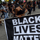 Counter-protesters dance on H Street Northwest outside of Lafayette Park during the Unite the Right rally on Aug. 12, 2018, in Washington, D.C.